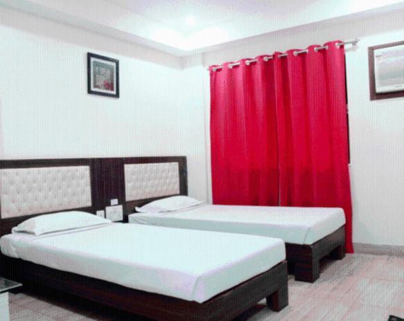 Hotel Crestwood Calcutá Quarto foto