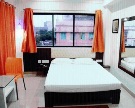 Hotel Crestwood Calcutá Quarto foto
